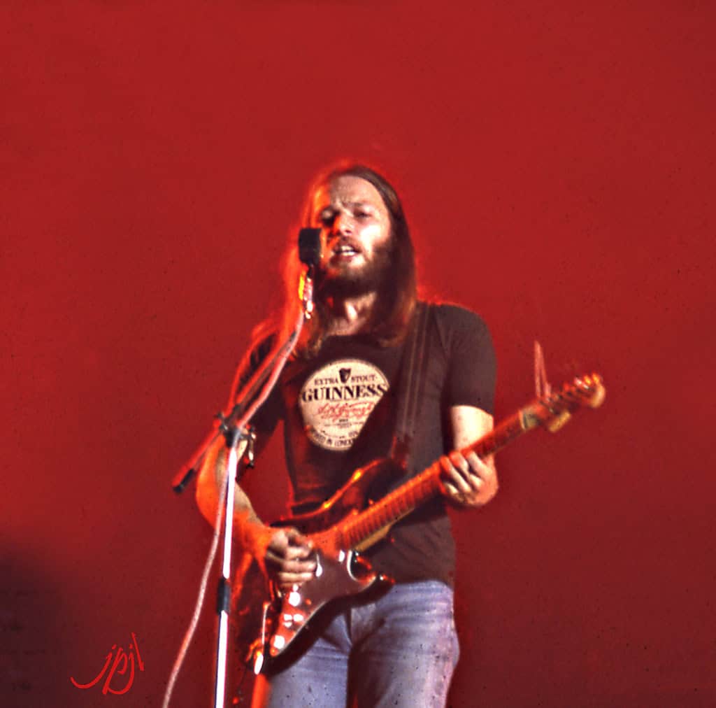 a man playing a guitar