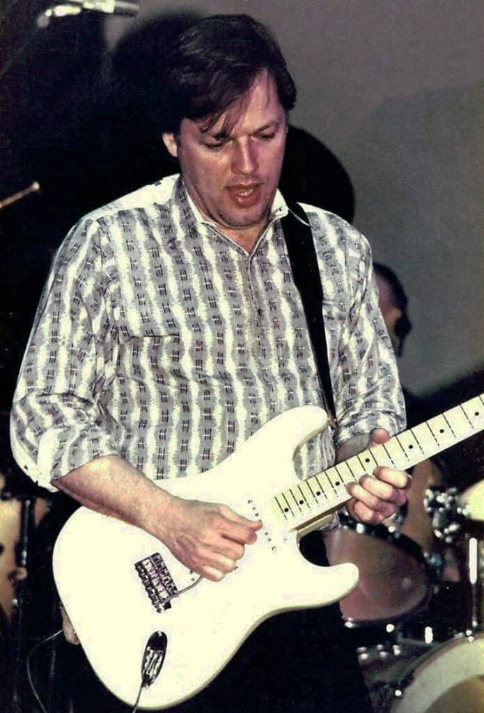 a man playing a guitar