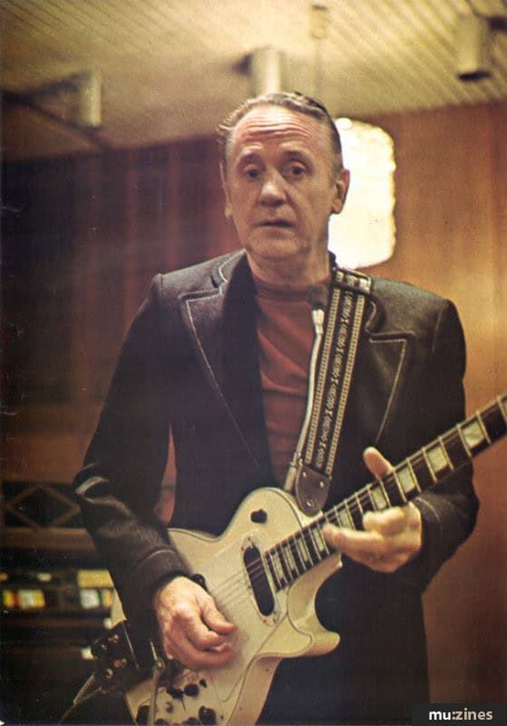 a man playing a guitar