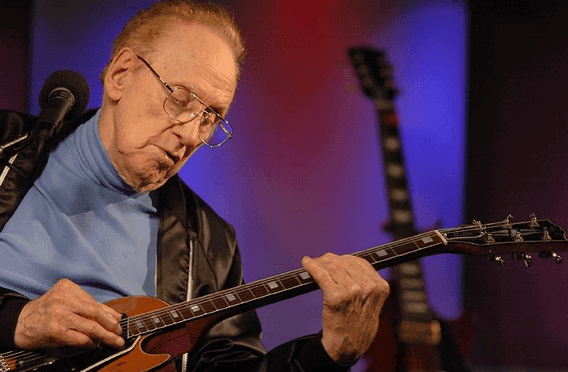 a man playing a guitar