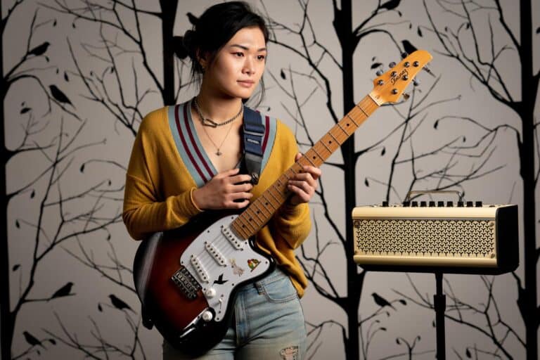 a woman holding a guitar