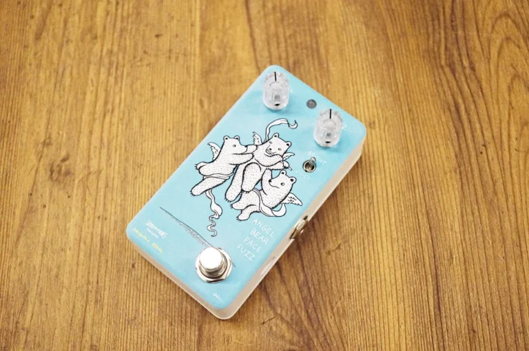 a blue and white box with two knobs and a picture of bears on it