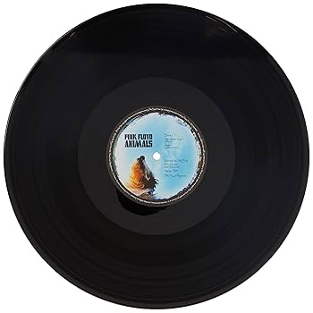 a black record with a label on it