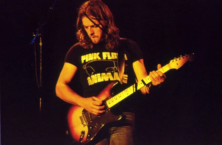 a man playing a guitar