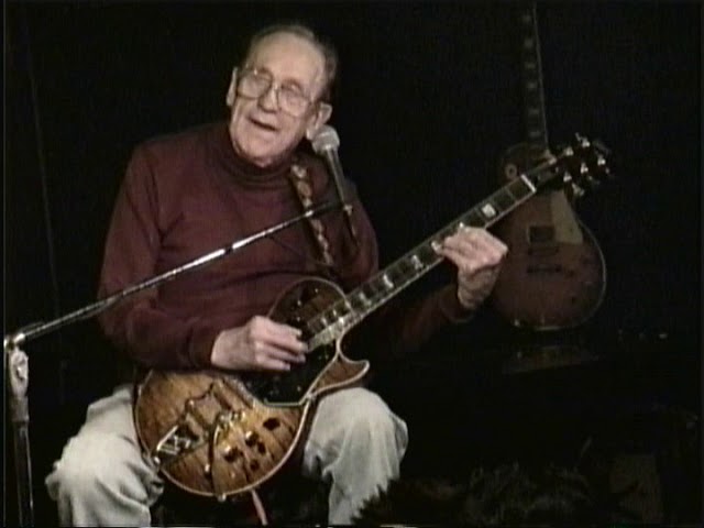 an old man playing a guitar