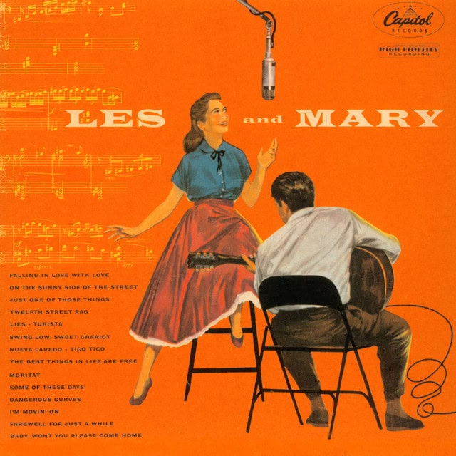 a man and woman on an orange cover