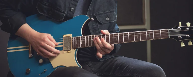 a person playing a guitar