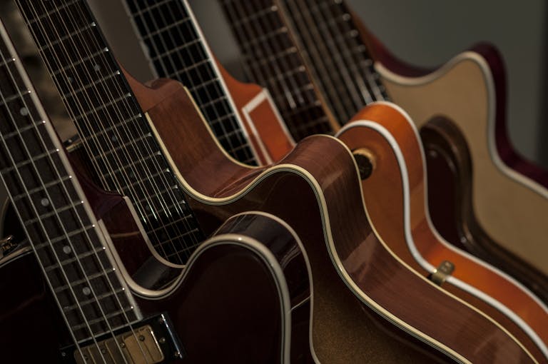 a group of guitars in a row