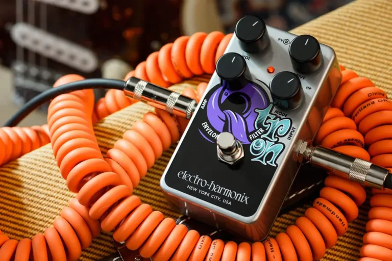 An Electro-Harmonix Nano Qtron pedal nested on a coily guitar cable