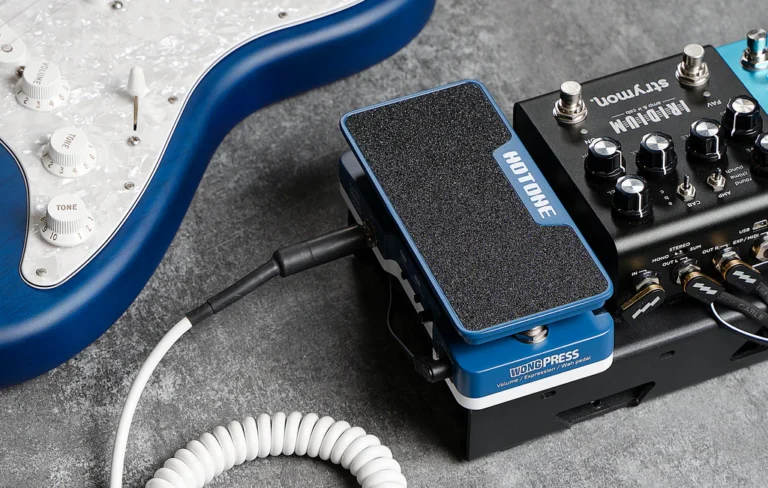 cory wong press pedal on the floor next to a stratocaster